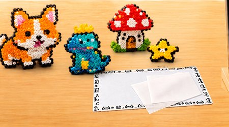 Finished pixel art pieces made from fuse beads